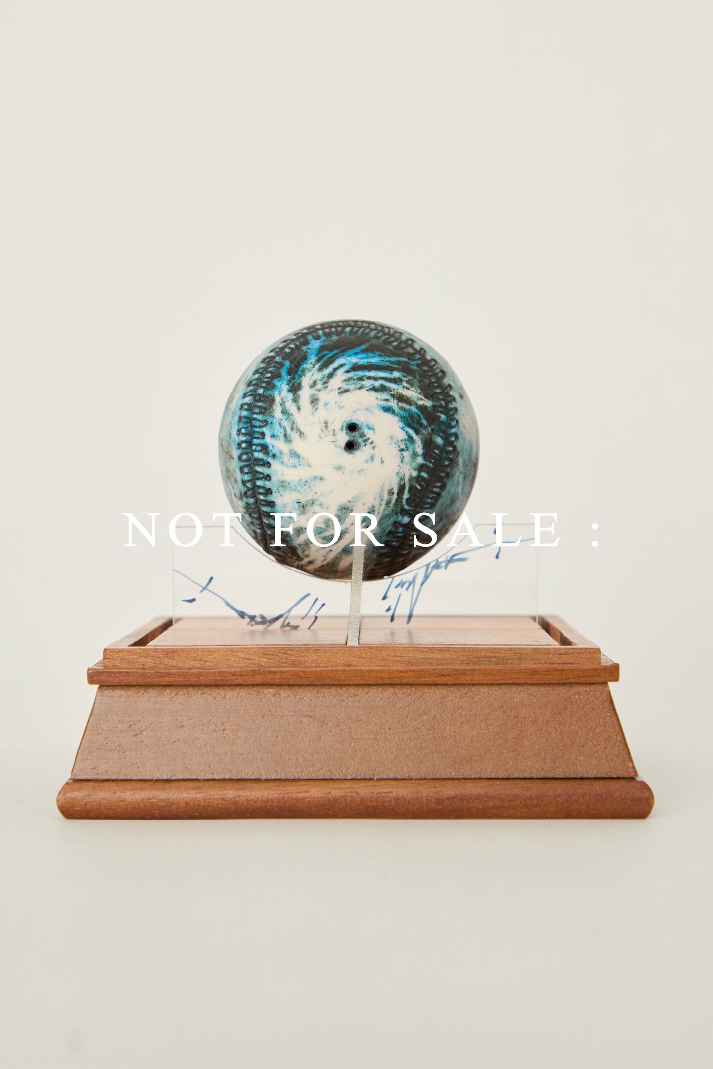 i'm here : Earth :  as a ceramic baseball