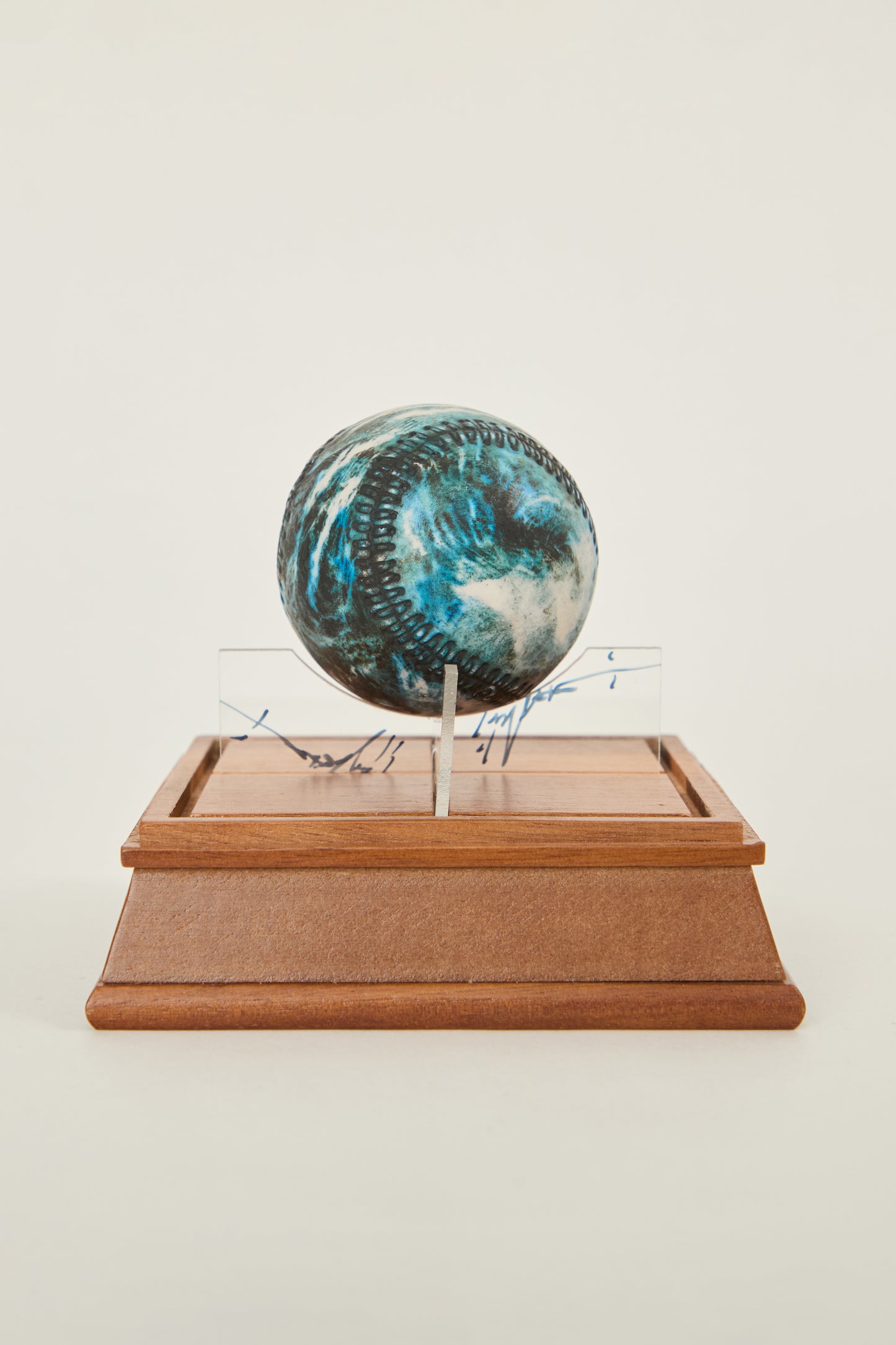 i'm here : Earth :  as a ceramic baseball