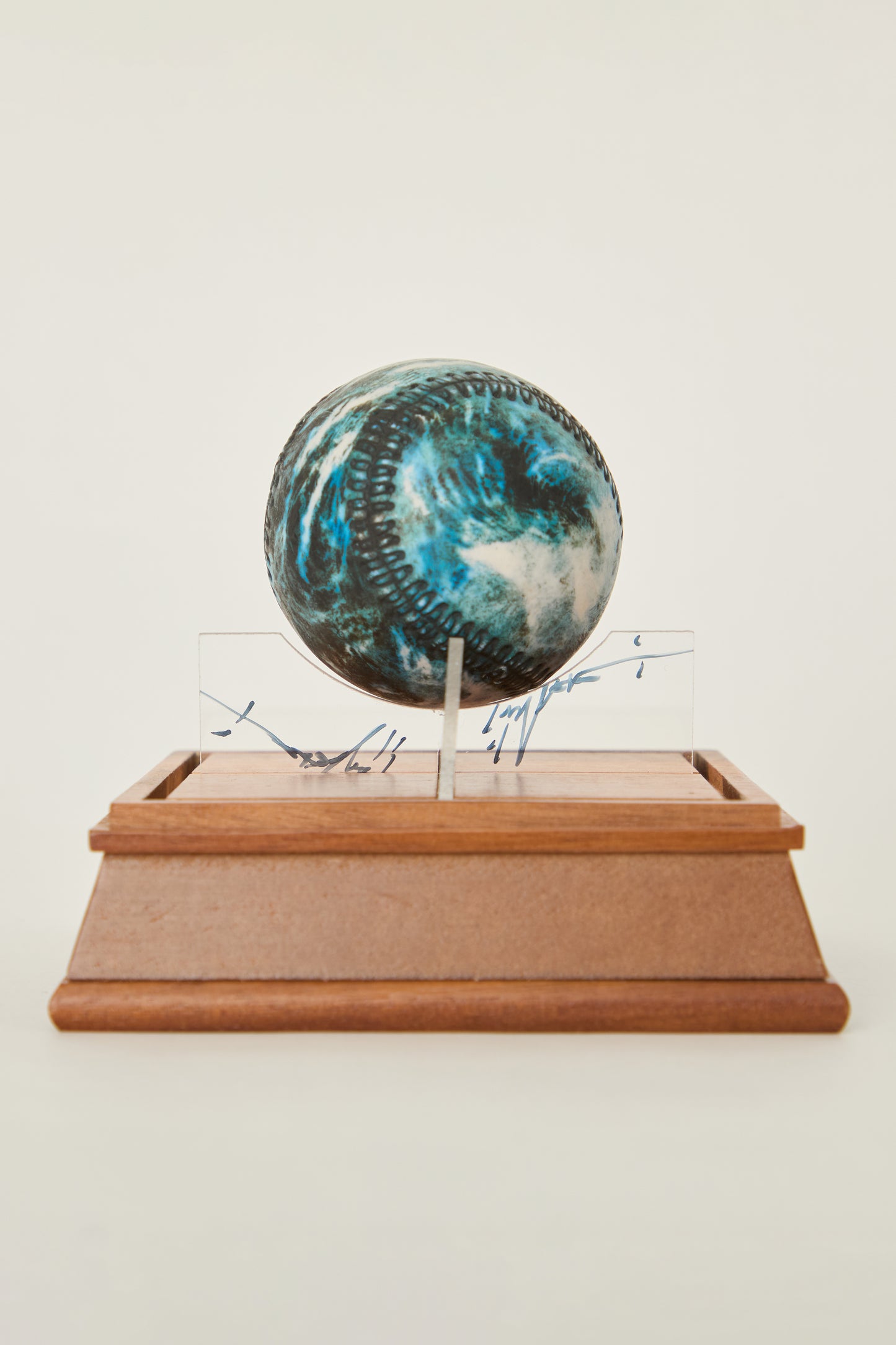 i'm here : Earth :  as a ceramic baseball