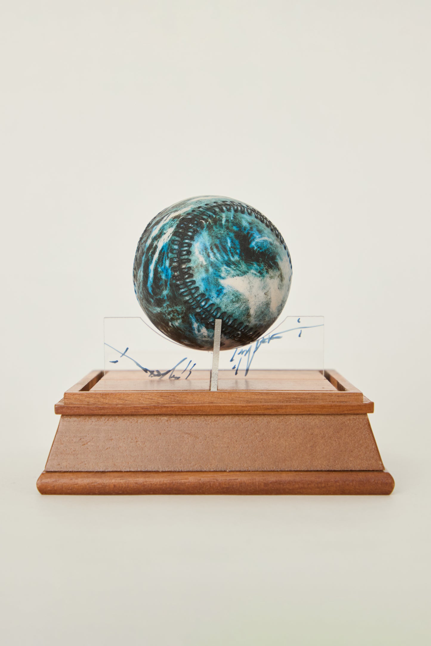 i'm here : Earth :  as a ceramic baseball