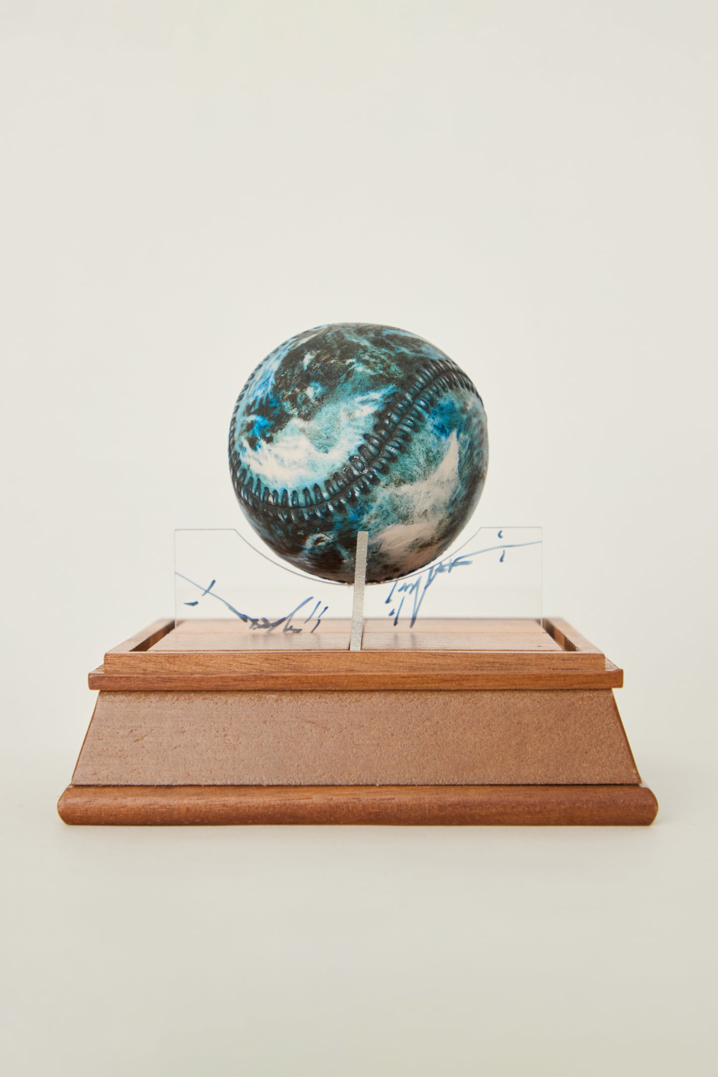 i'm here : Earth :  as a ceramic baseball