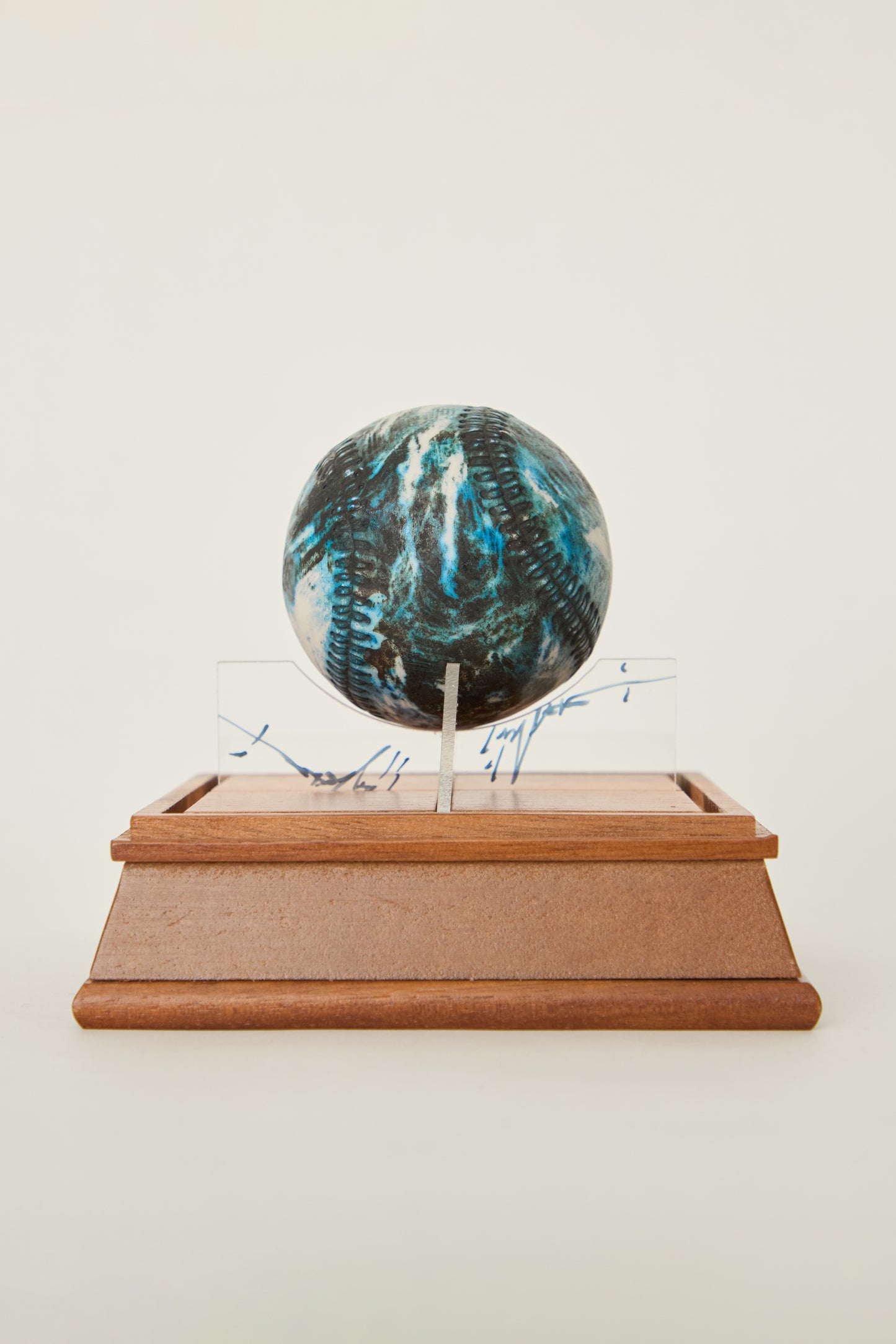 i'm here : Earth :  as a ceramic baseball