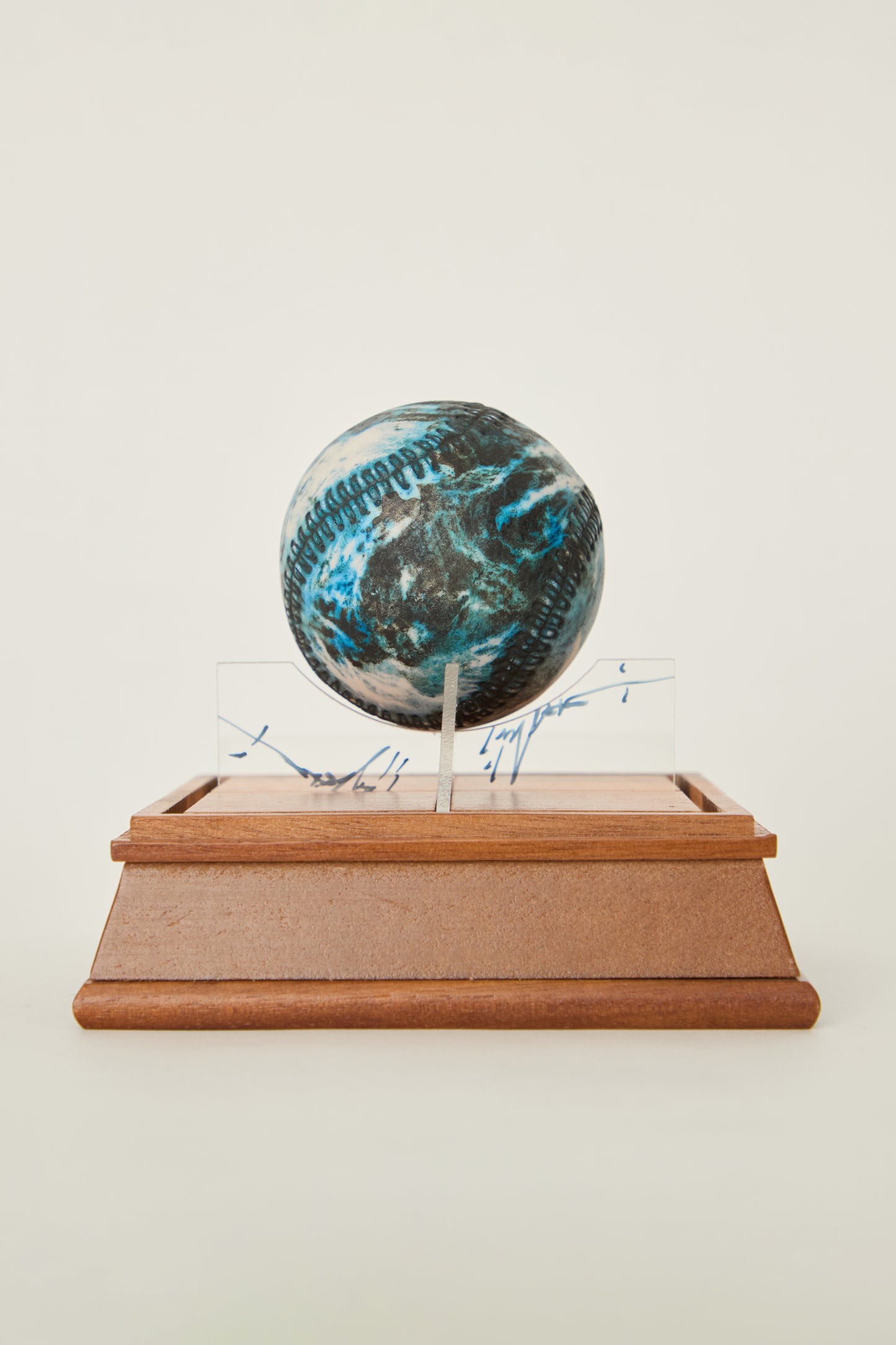 i'm here : Earth :  as a ceramic baseball