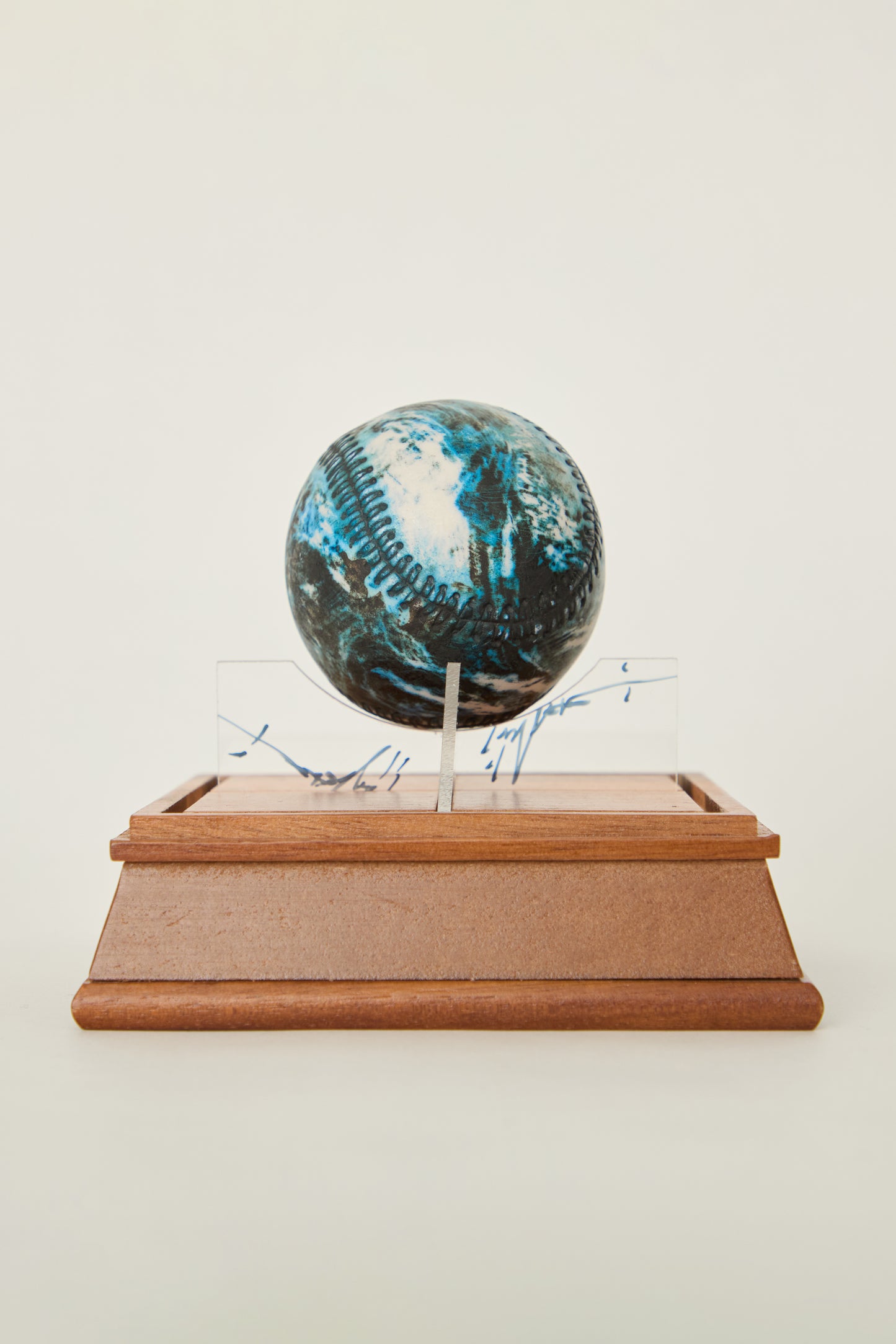 i'm here : Earth :  as a ceramic baseball