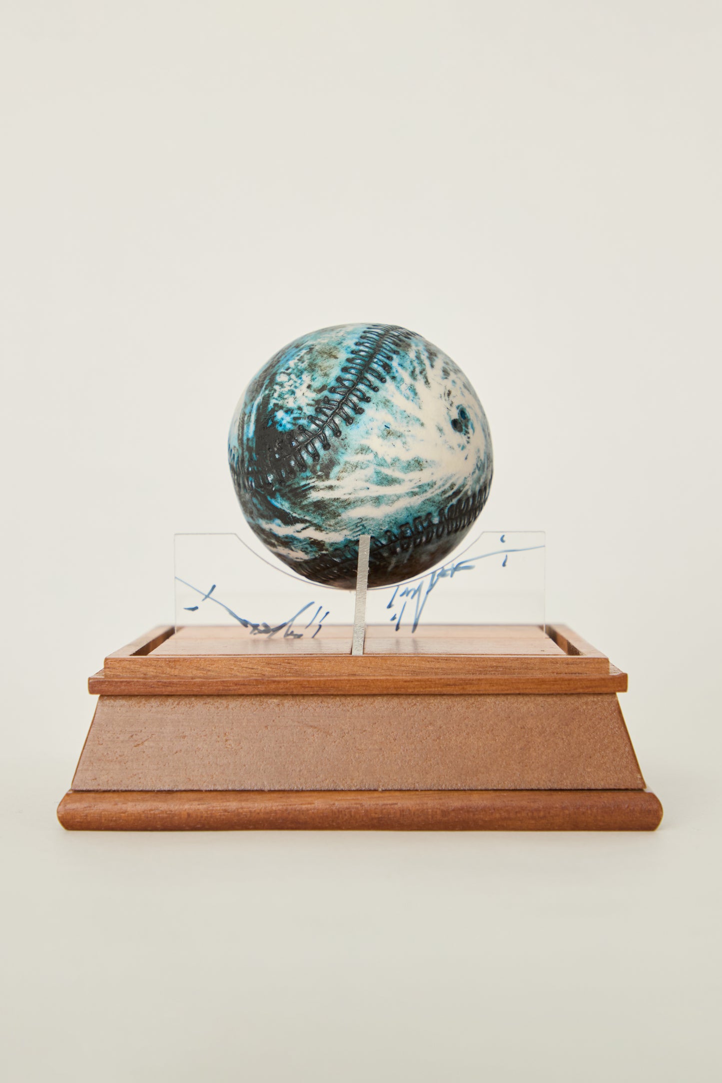 i'm here : Earth :  as a ceramic baseball