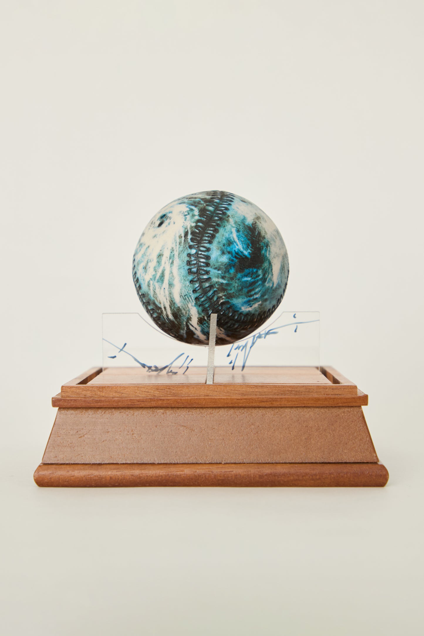 i'm here : Earth :  as a ceramic baseball