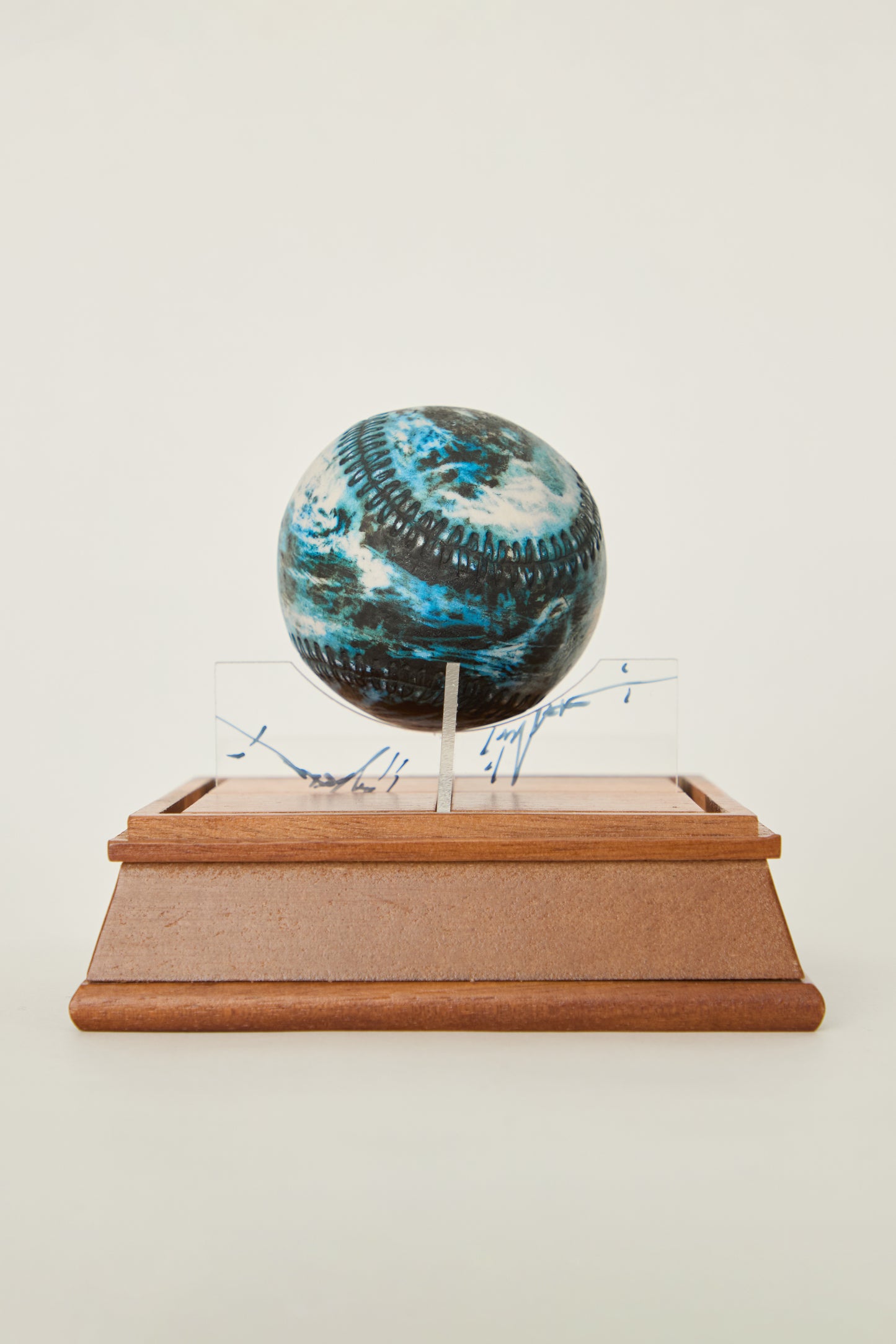 i'm here : Earth :  as a ceramic baseball