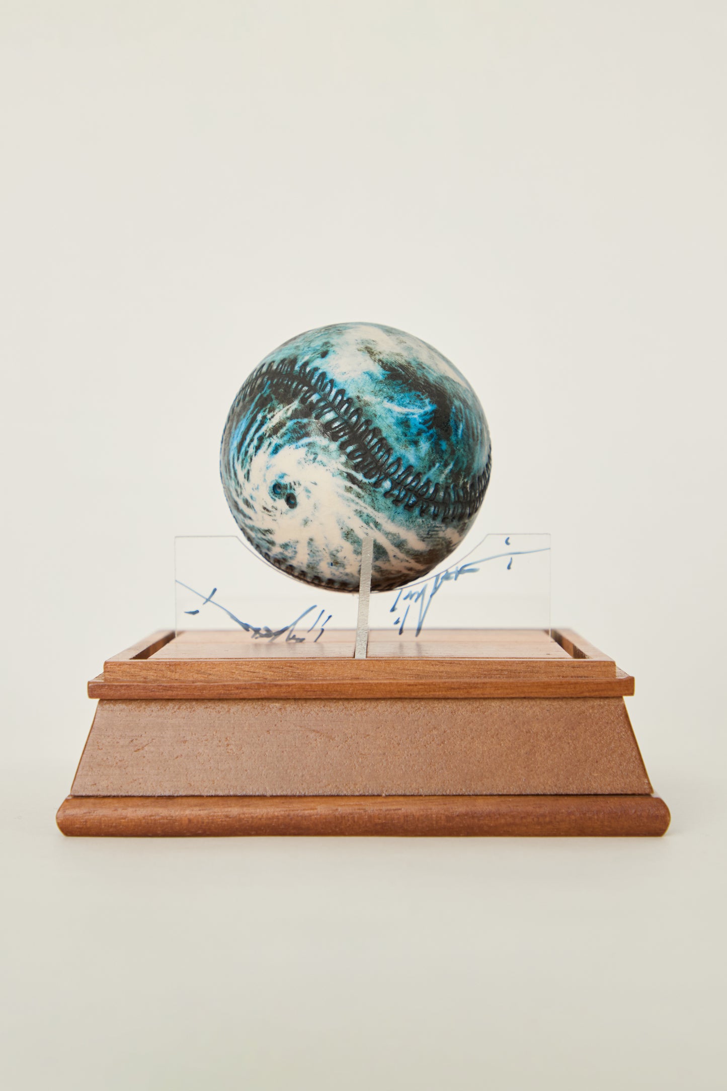 i'm here : Earth :  as a ceramic baseball