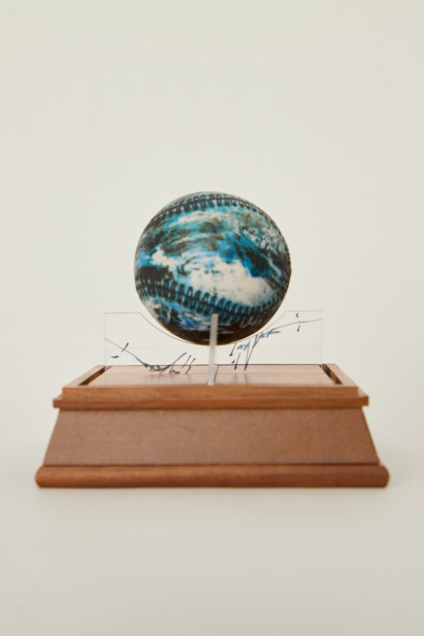 i'm here : Earth :  as a ceramic baseball